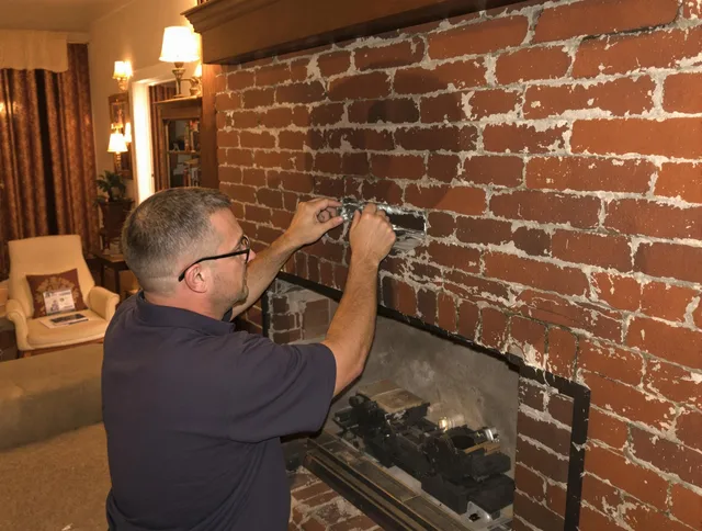 Fairview Park Chimney Sweep expert fixing a fireplace in Fairview Park, OH
